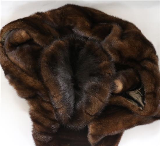 A brown mink evening stole and hat